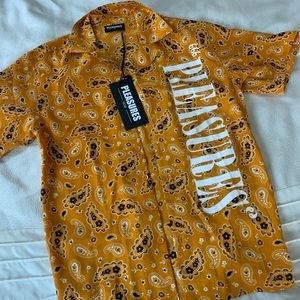 Orange bandana print PLEASURES button up shirt. Size small. Brand new